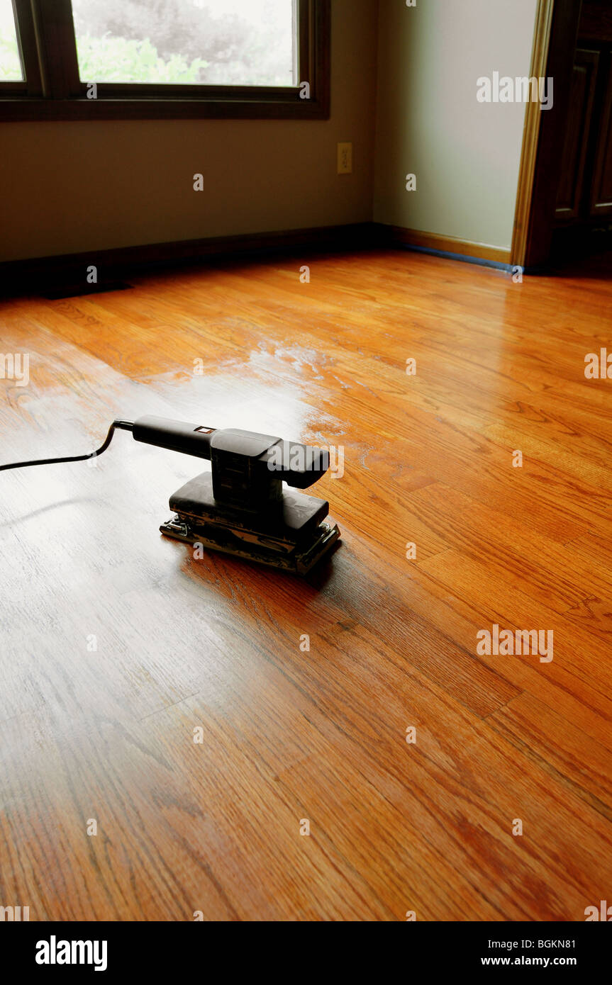 Random orbital electric sander and a hardwood floor refinishing