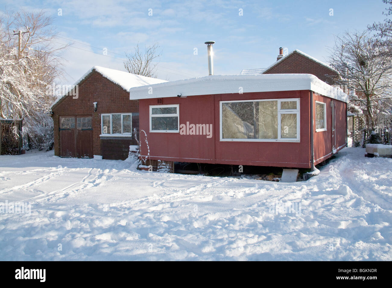 Mobile home or static caravan in the snow Hampshire England. Stock Photo