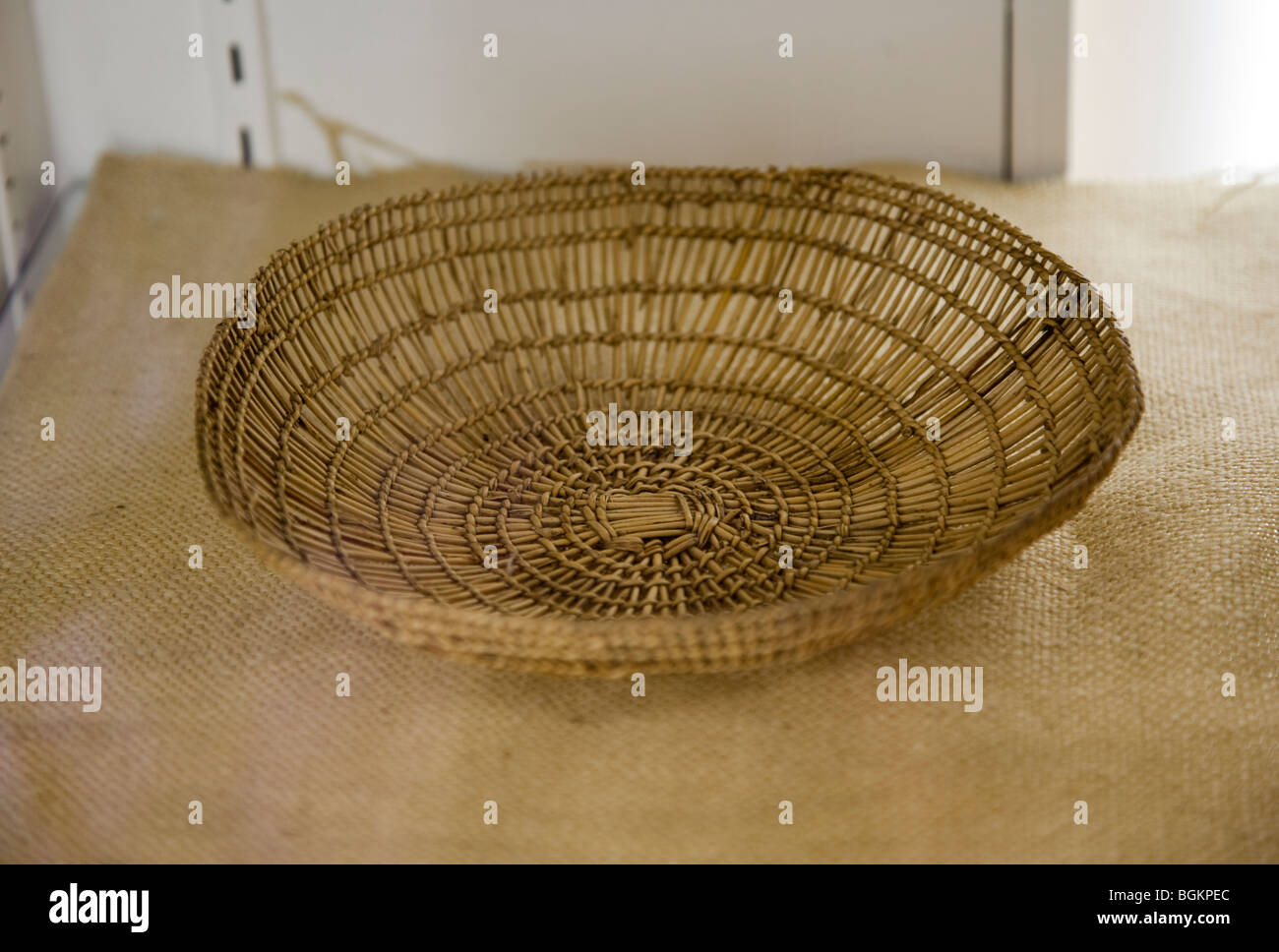 Traditional Klamath winnowing basket, made from plant fibers, used to