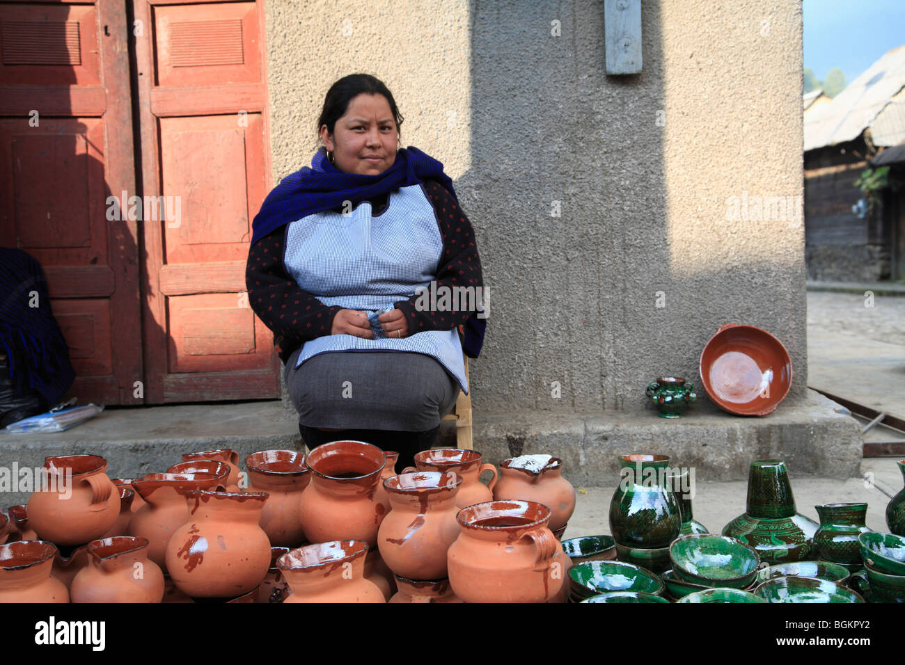 Woman selling pottery, Angahuan, Pueblo near volcano Paricutin, Michoacan State, Mexico, North America Stock Photo