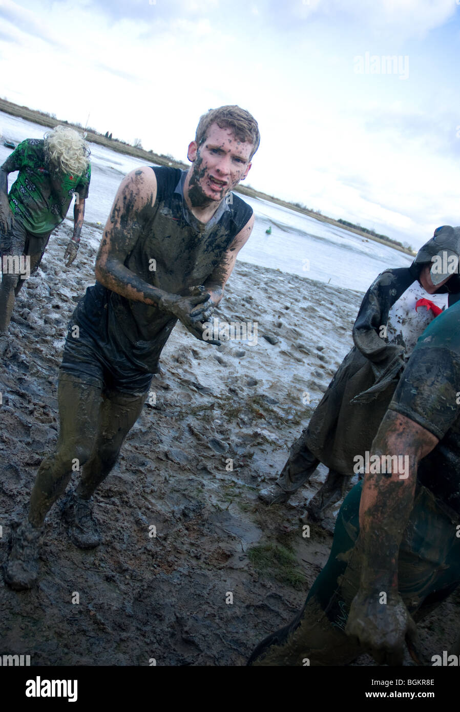 a competitor shivers in the cold after competing in the maldon mud race Stock Photo