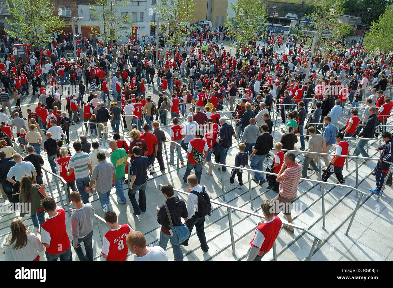 Crowds fans walking down the steps of Arsenal Football Club Emirates