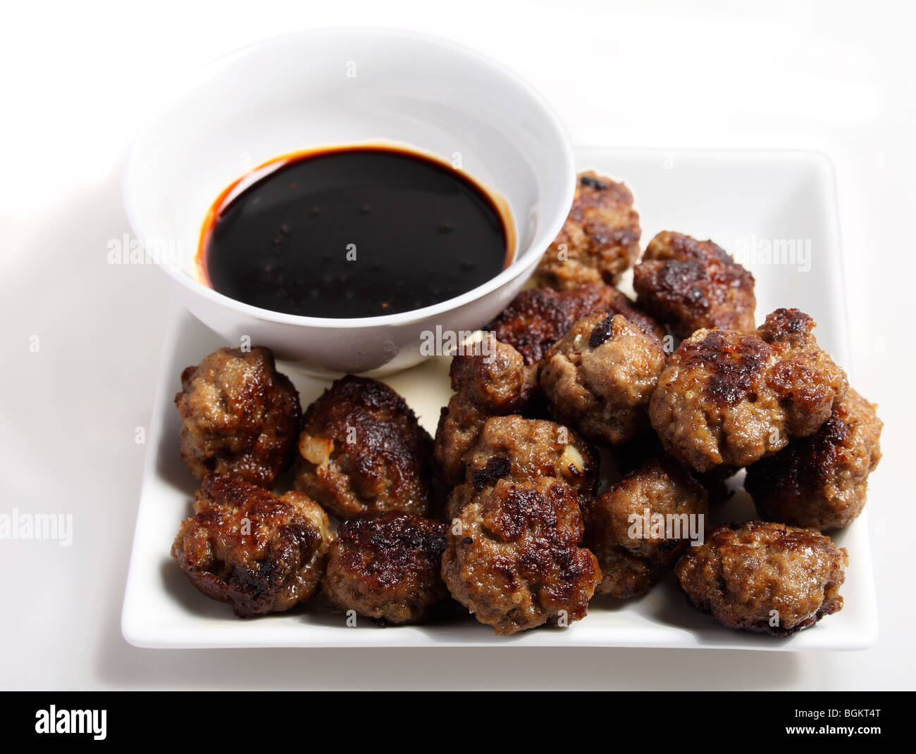Fried meatballs with a dip of brown sauce Stock Photo Alamy