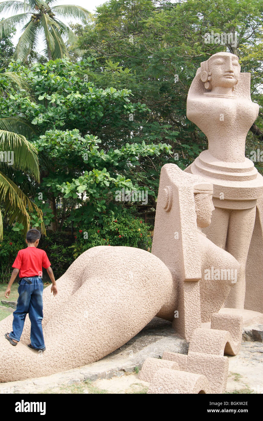 Boy standing in a Beautiful statue in Veli tourism Village Stock Photo