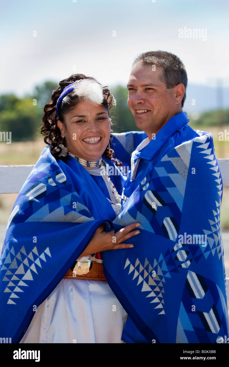Native American newlywed couple dressed in traditional clothing are