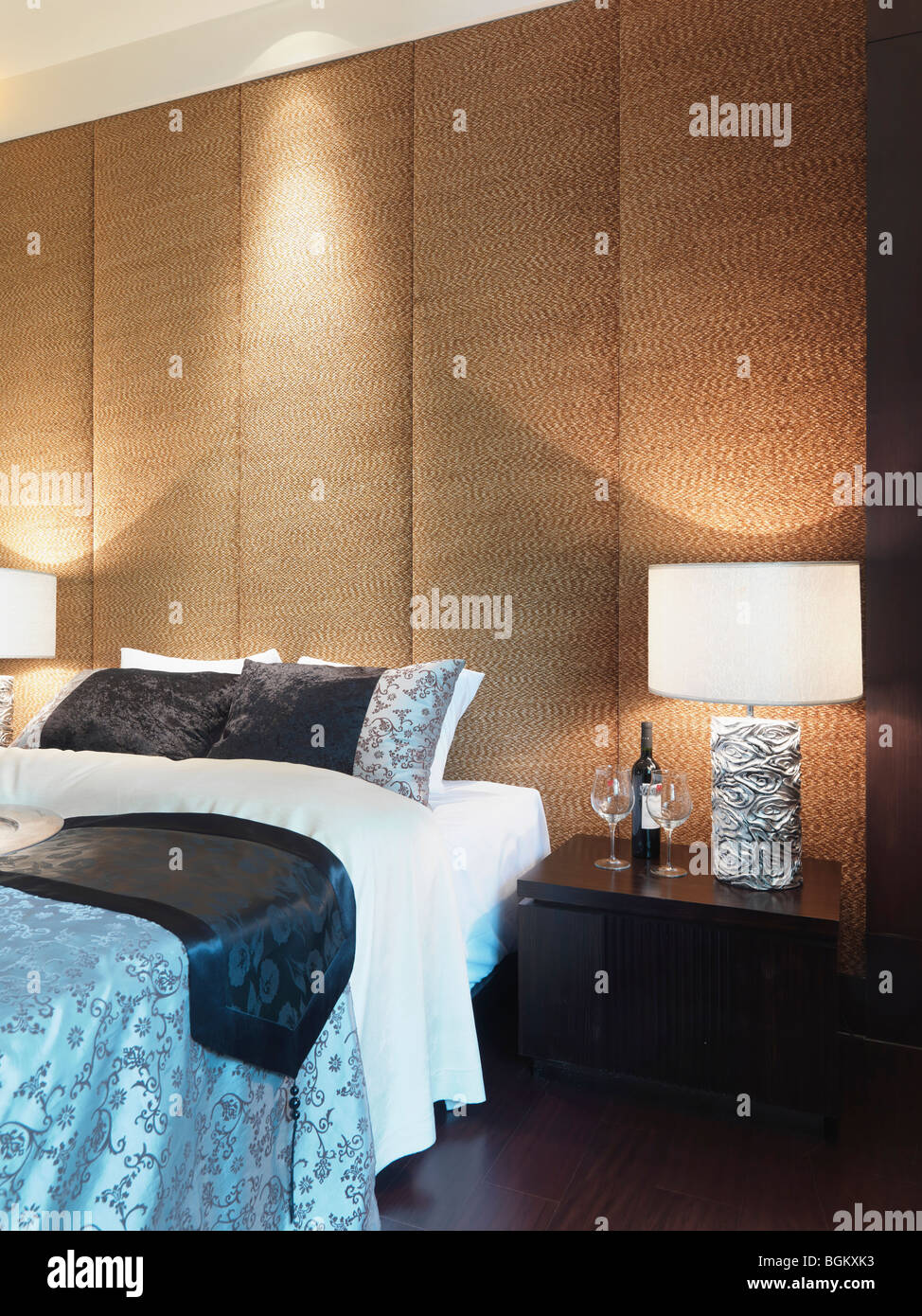 Textured wall behind bed Stock Photo Alamy