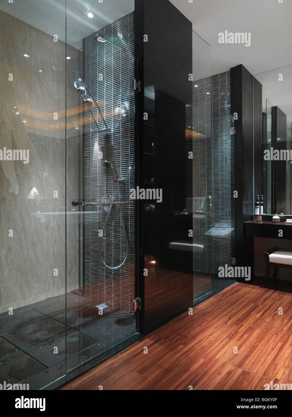 Dark glass shower in bathroom with hardwood floor Stock Photo Alamy