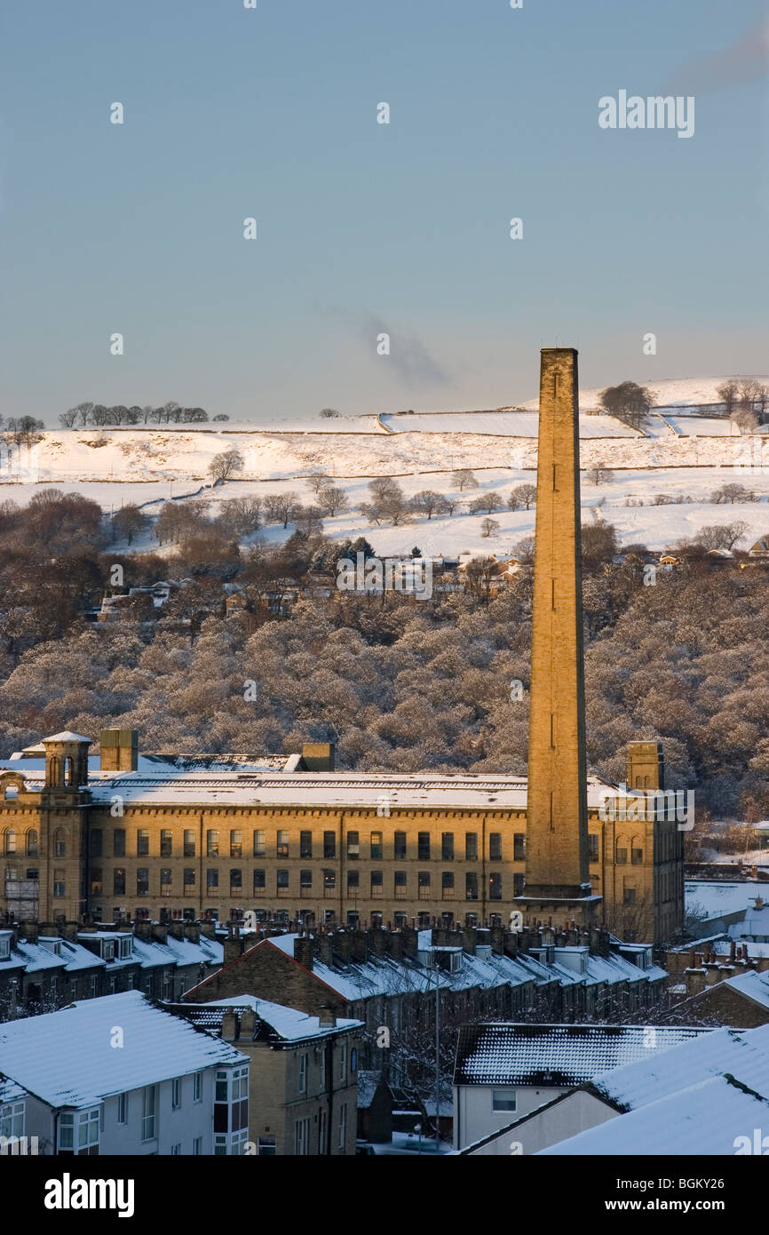 A winter view over rows of terraced houses to Salts Mill, in Saltaire near Bradford, West Yorkshire Stock Photo