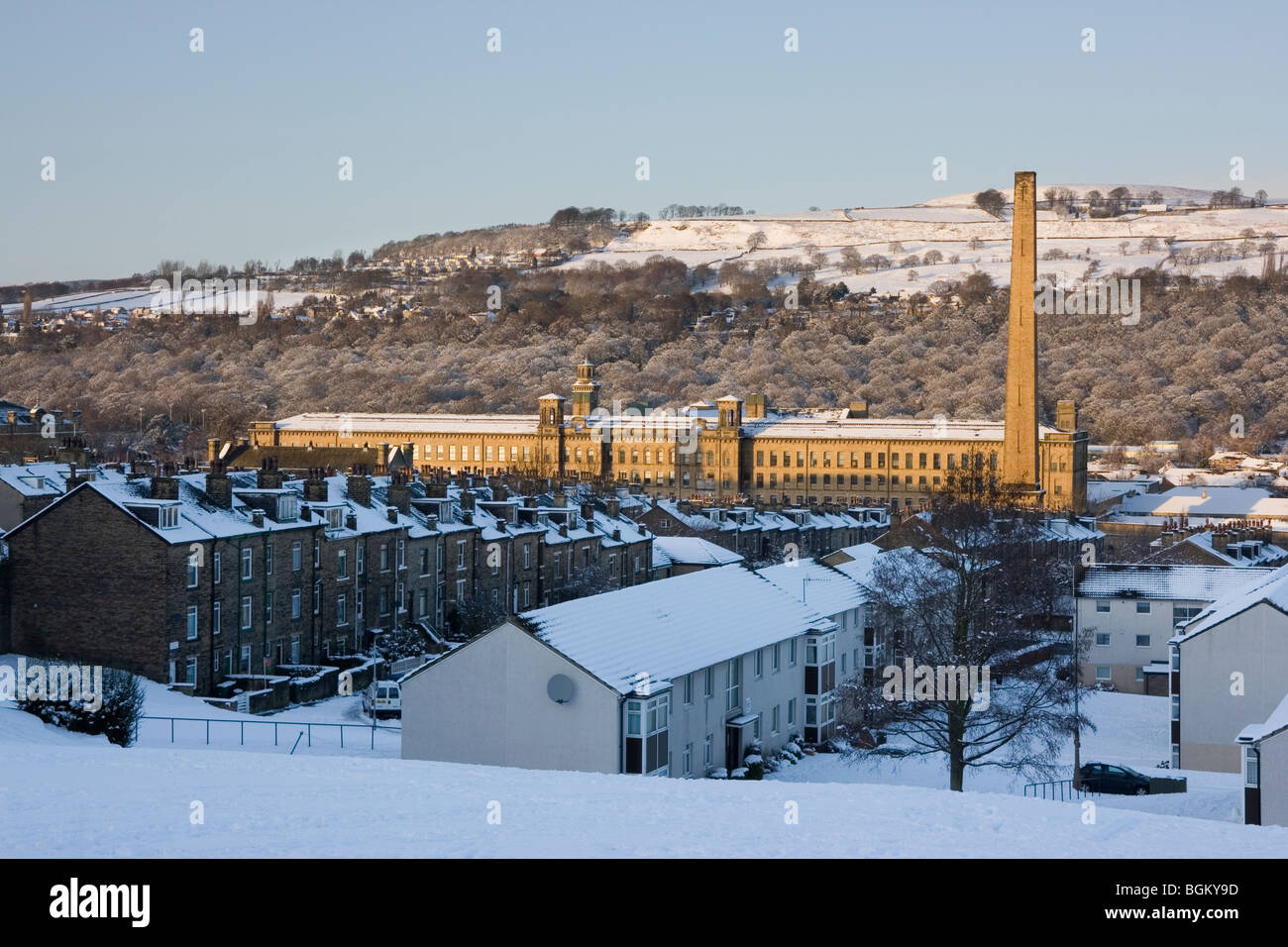 A winter view over rows of terraced houses to Salts Mill, in Saltaire near Bradford, West Yorkshire Stock Photo