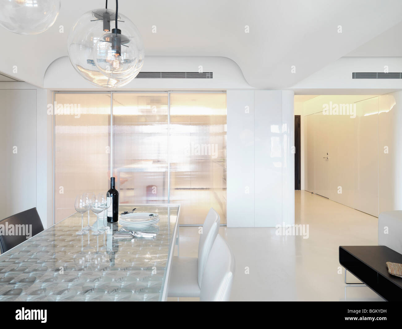 Dining table in white modern interior Stock Photo - Alamy