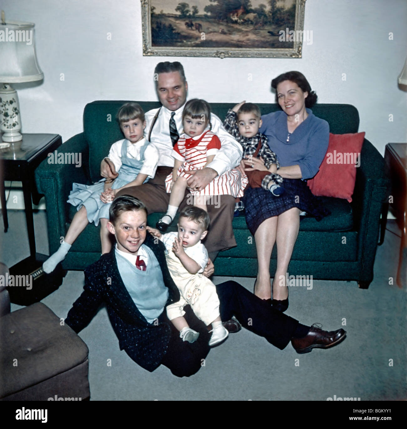 Family Archives Photo. Large Family Portrait "Old Family Photos" Group sitting on Couch in Living Room Home, vintage American photos, New Jersey 1950s Stock Photo