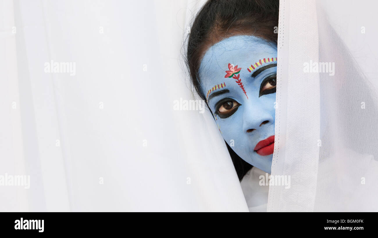 Indian girl, face painted as the Hindu goddess Sita. India Stock Photo
