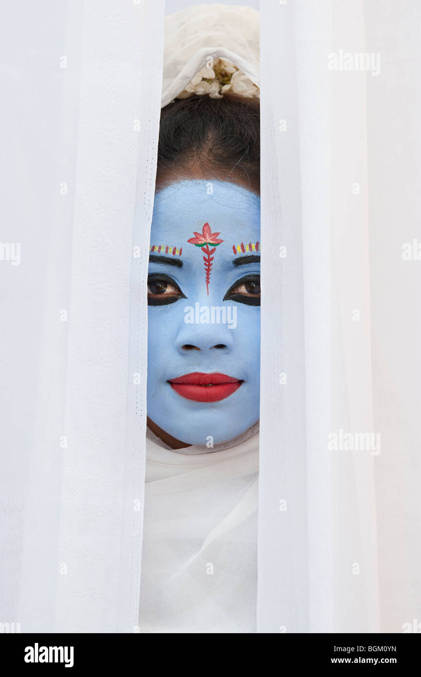 Indian girl, face painted as the Hindu goddess Sita. India Stock Photo