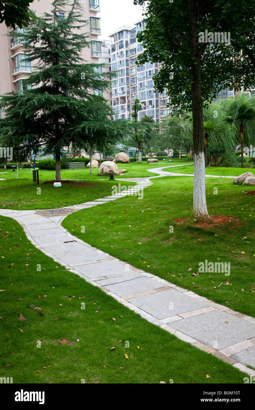 footpath and bench in a garden,with green grass background Stock Photo ...
