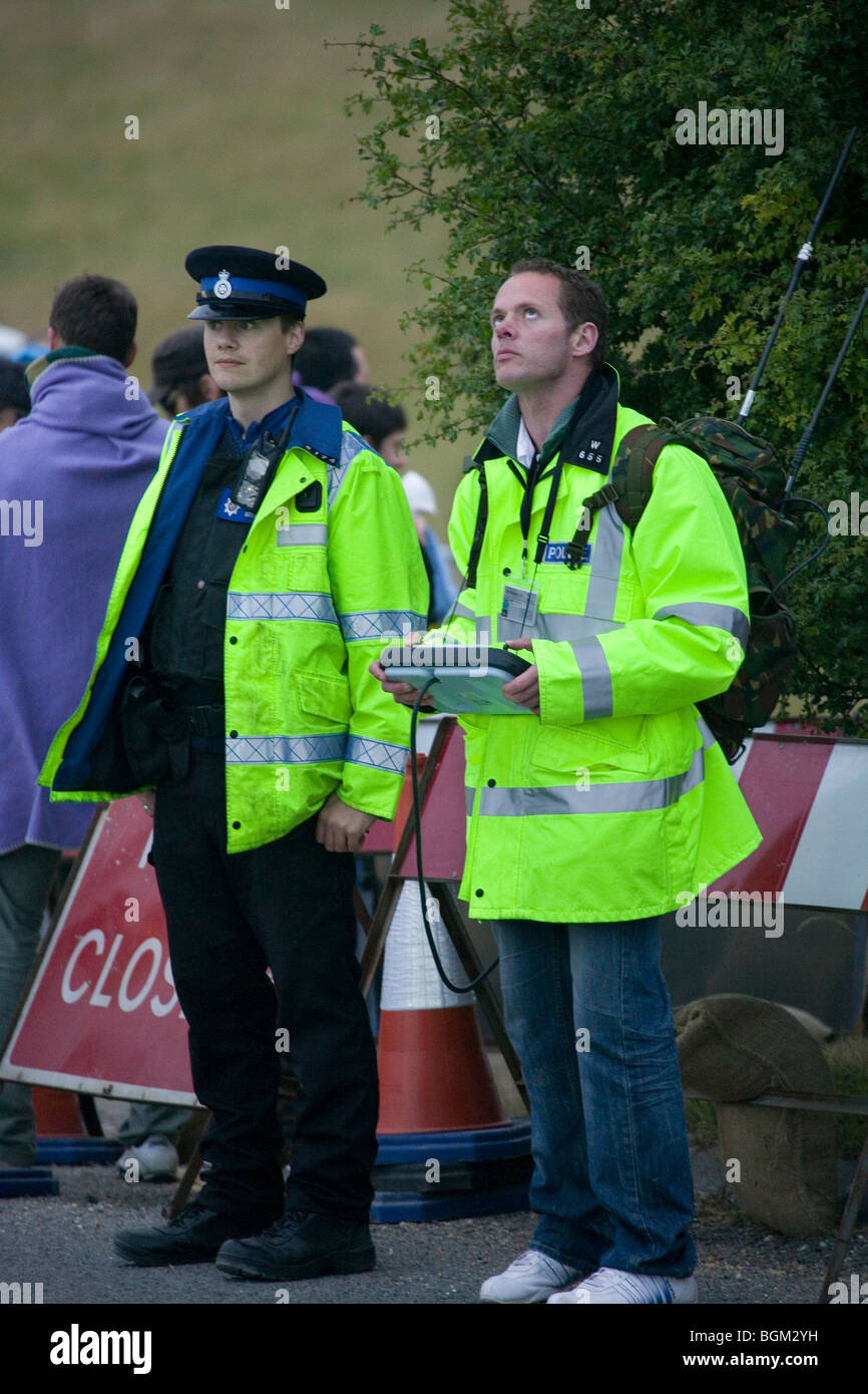 Police office with remote control unit flying the surveillance drone at Stonehenge. AirRobot