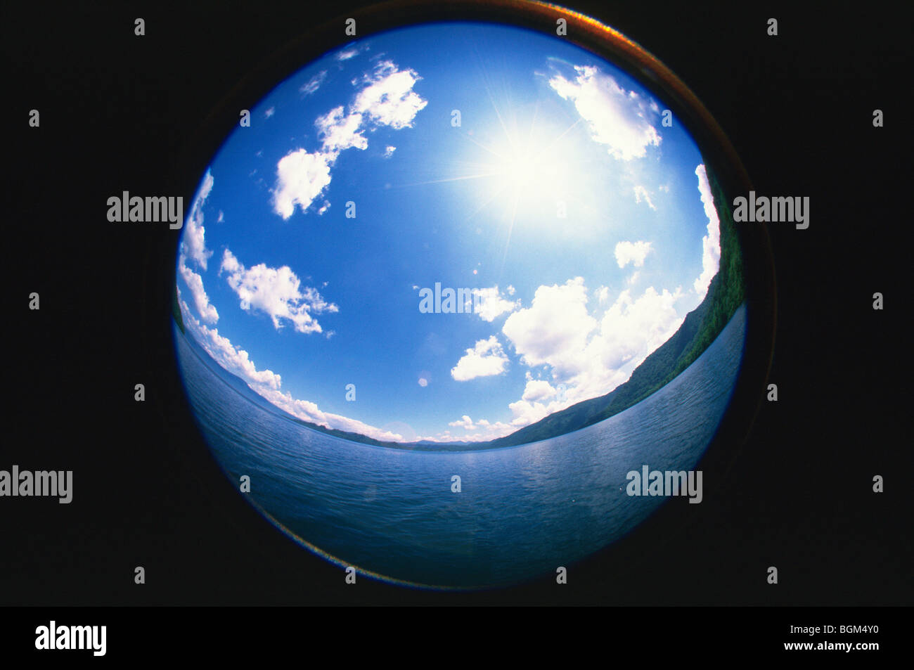 Sphere reflecting water sun blue sky and clouds Stock Photo - Alamy