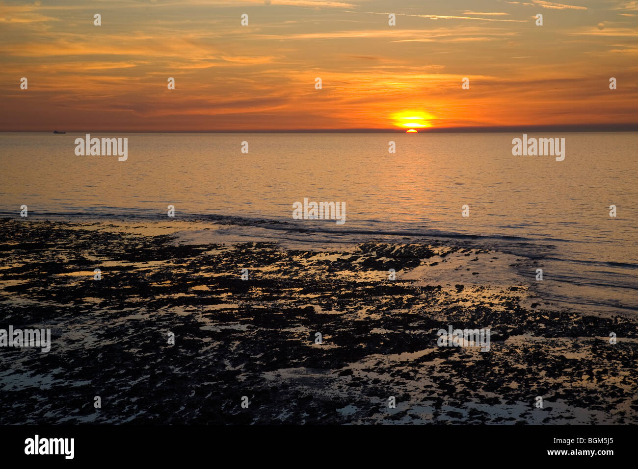 Sunset along coast in Ault, France Stock Photo