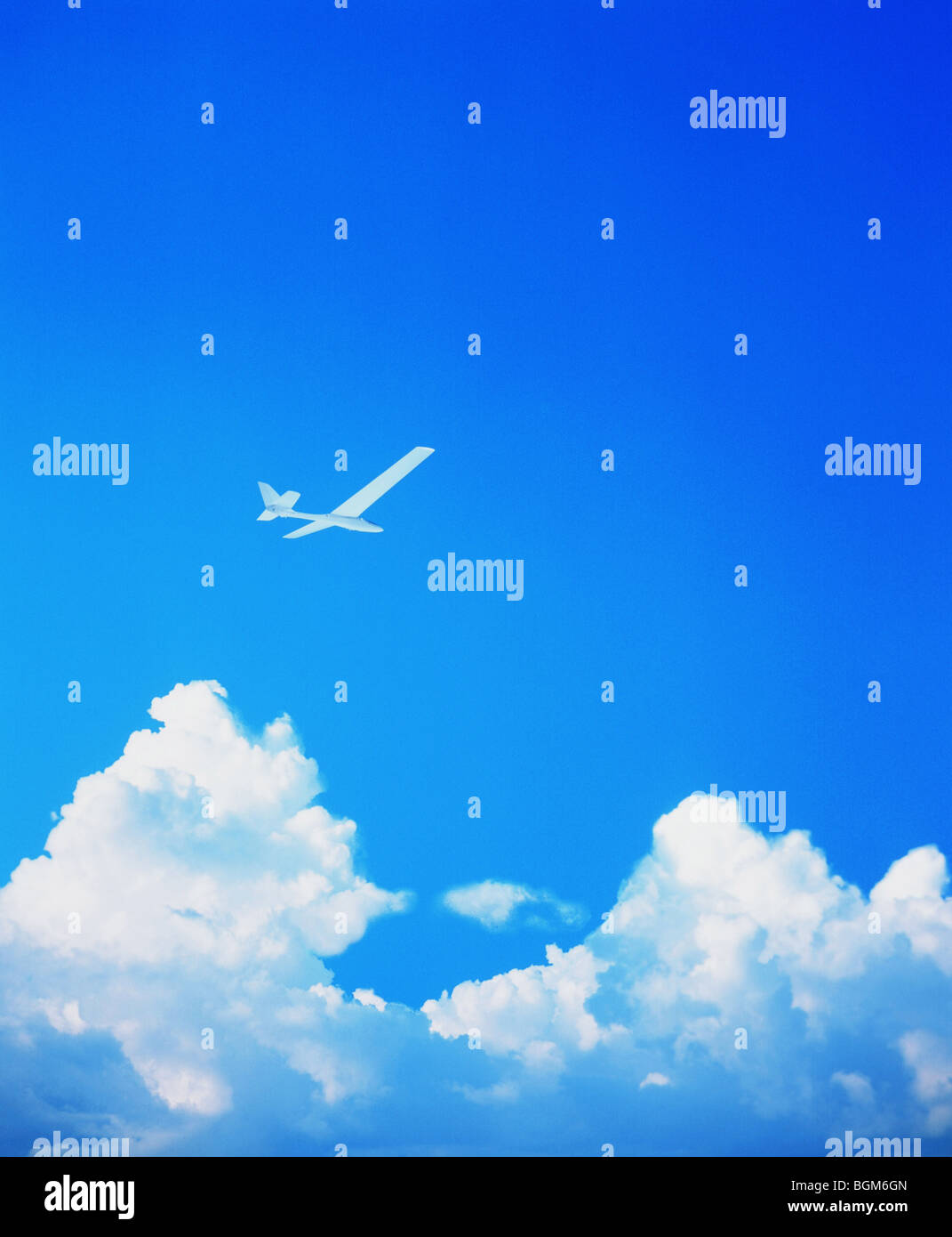 Airplane flying above clouds Stock Photo - Alamy