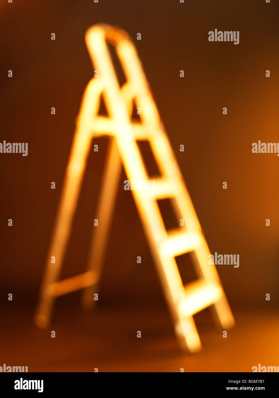 step ladders gold color Stock Photo