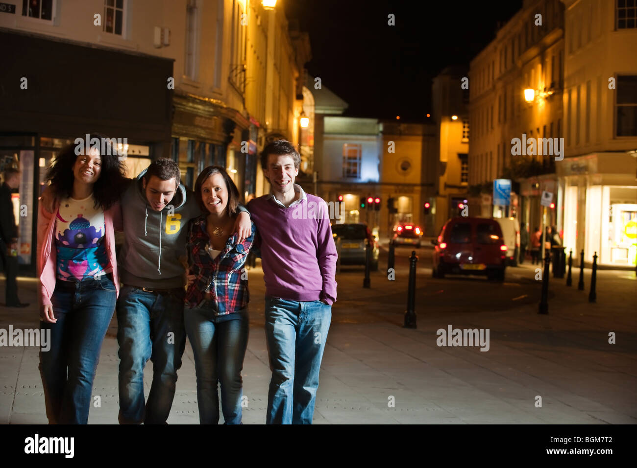young drunk people at night in town Stock Photo Alamy