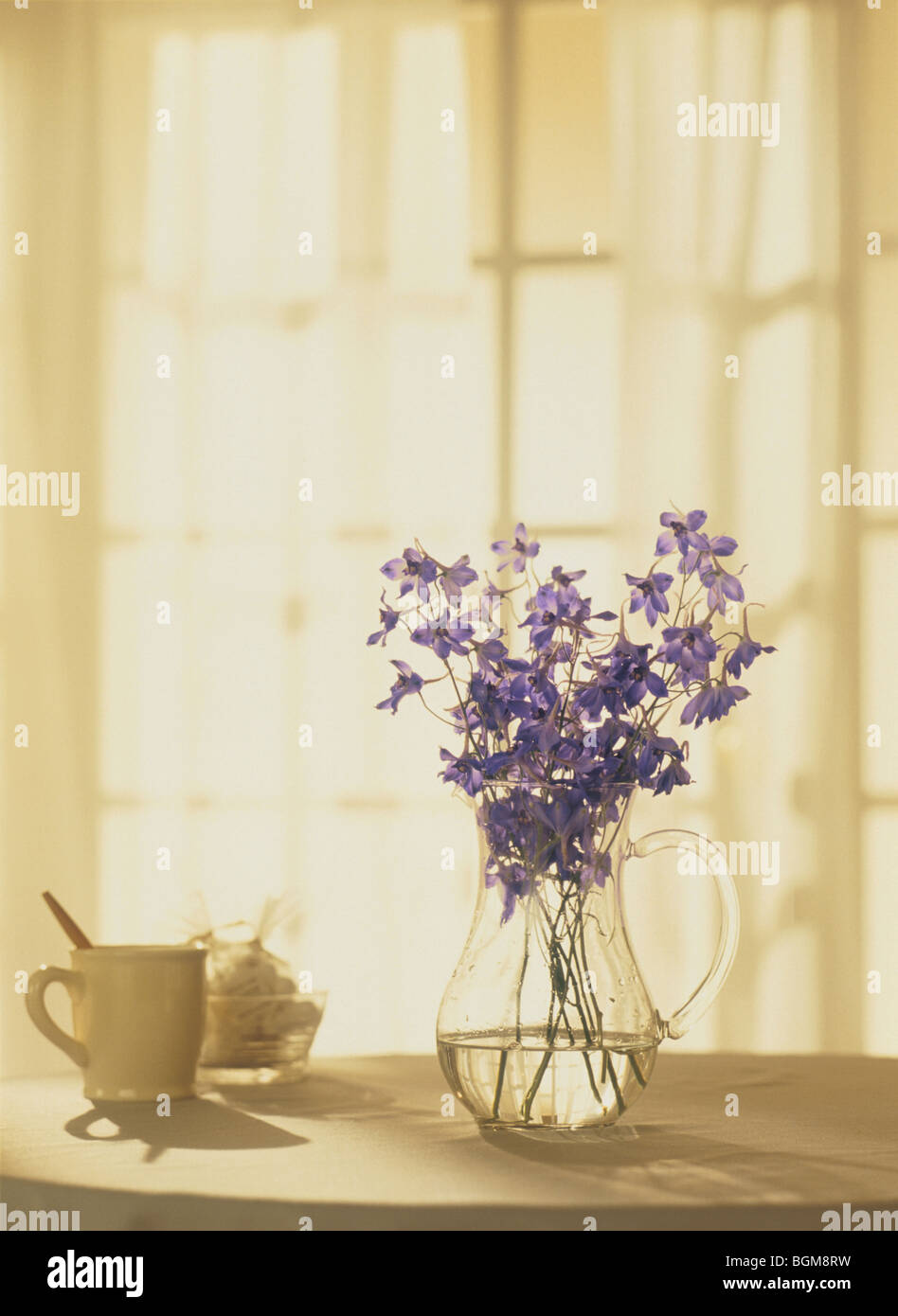 Flowers in a vase on a tabletop Stock Photo Alamy