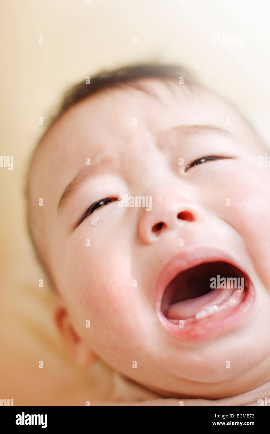 Baby crying with mouth open Stock Photo Alamy