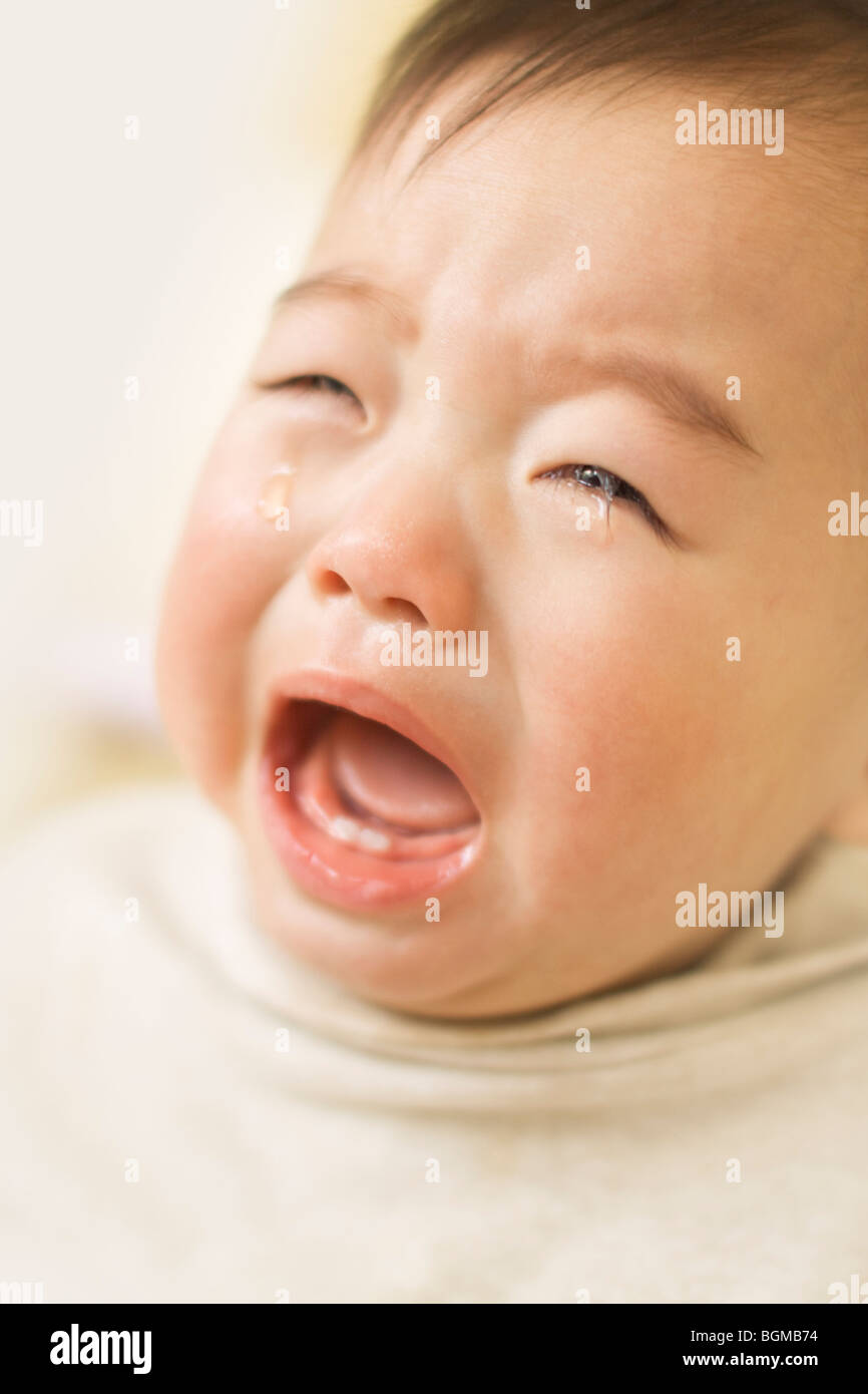 Baby crying with mouth open Stock Photo Alamy