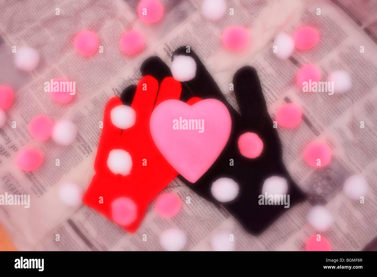 Gloves and heart shape on newspaper Stock Photo Alamy