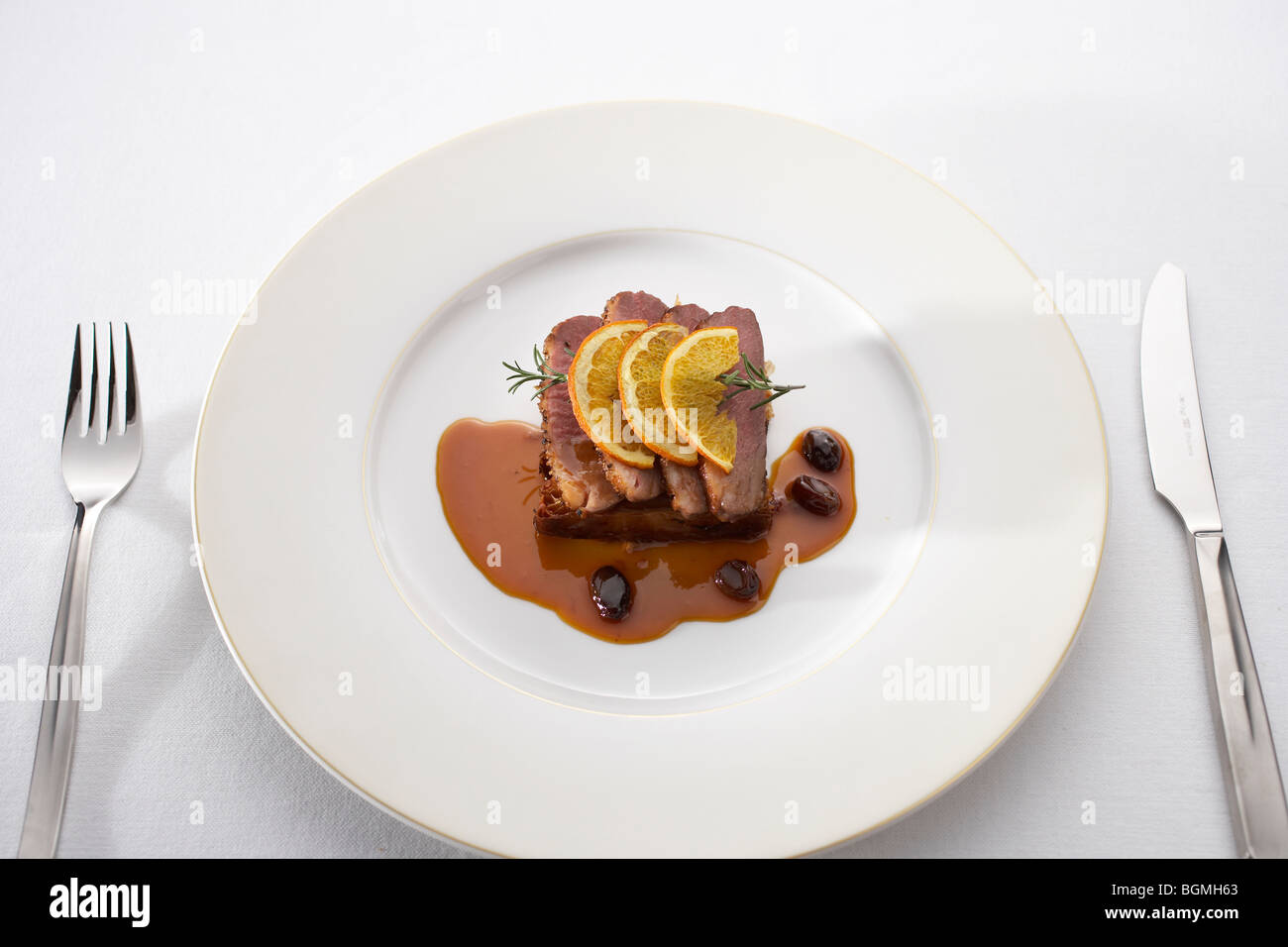 Roast duck with orange sauce Stock Photo - Alamy