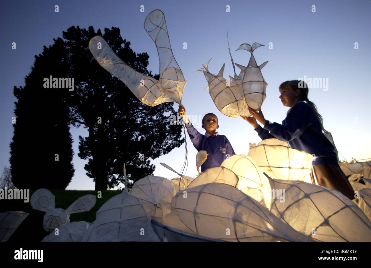Children with giant seed pod sculptures they created for the Millenium Seed Bank, Wakehurst Place, Sussex. Stock Photo