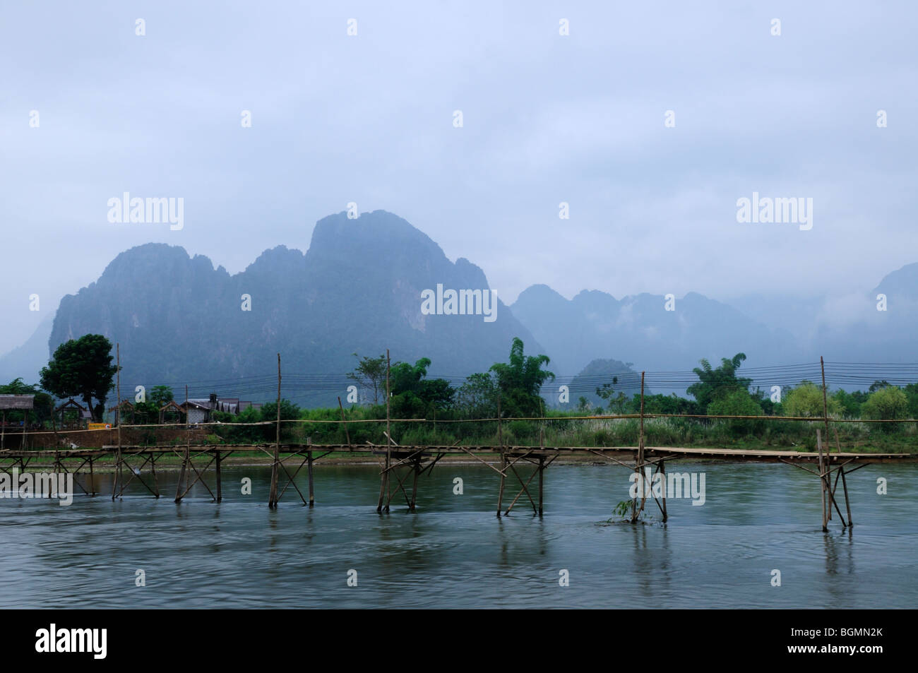 Laos; Vang Vieng; Bridge over the Nam Song River at first light Stock Photo