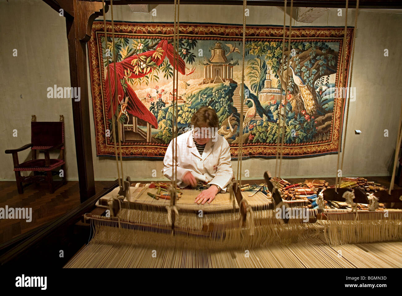 Woman at work in the Royal Tapestry Factory Gaspard De Wit, Malines, Belgium Stock Photo