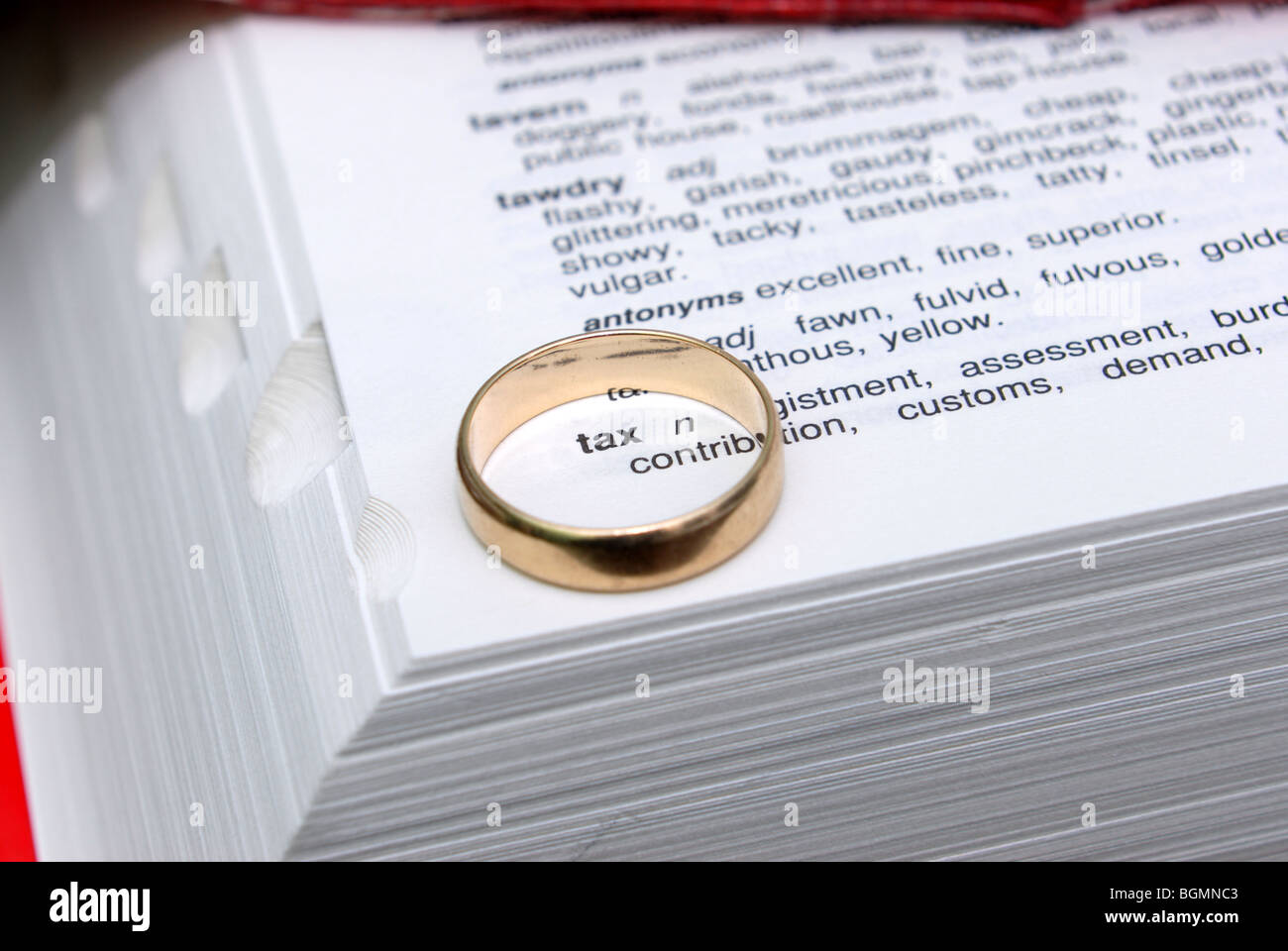 wedding-ring-on-dictionary-and-thesaurus-with-the-words-tax-and