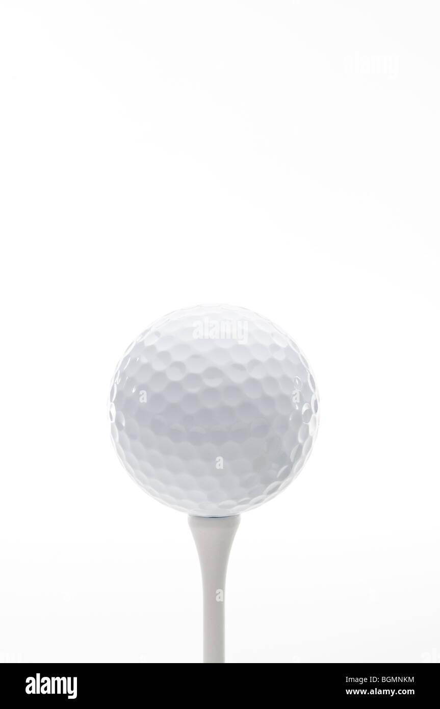 Vertical close up of a golf ball on a tee Stock Photo