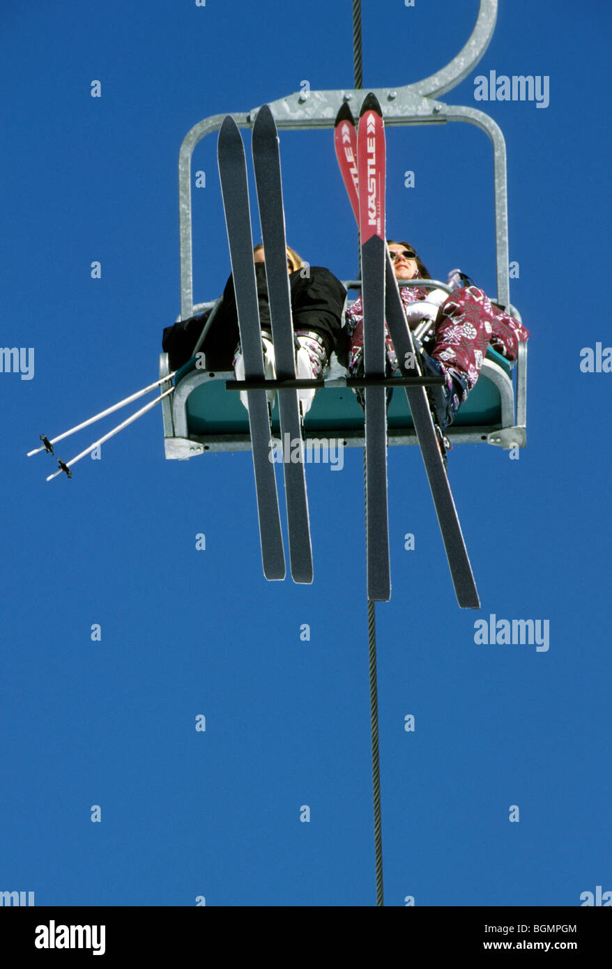Skiers on chair lift, Europe Stock Photo Alamy