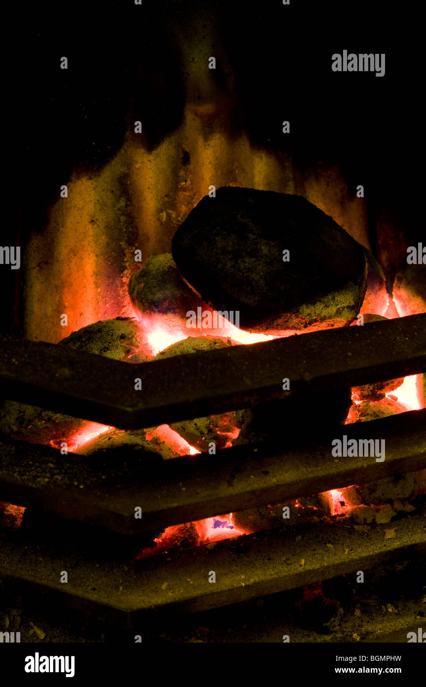 Smokeless coal burning in a fireplace Stock Photo