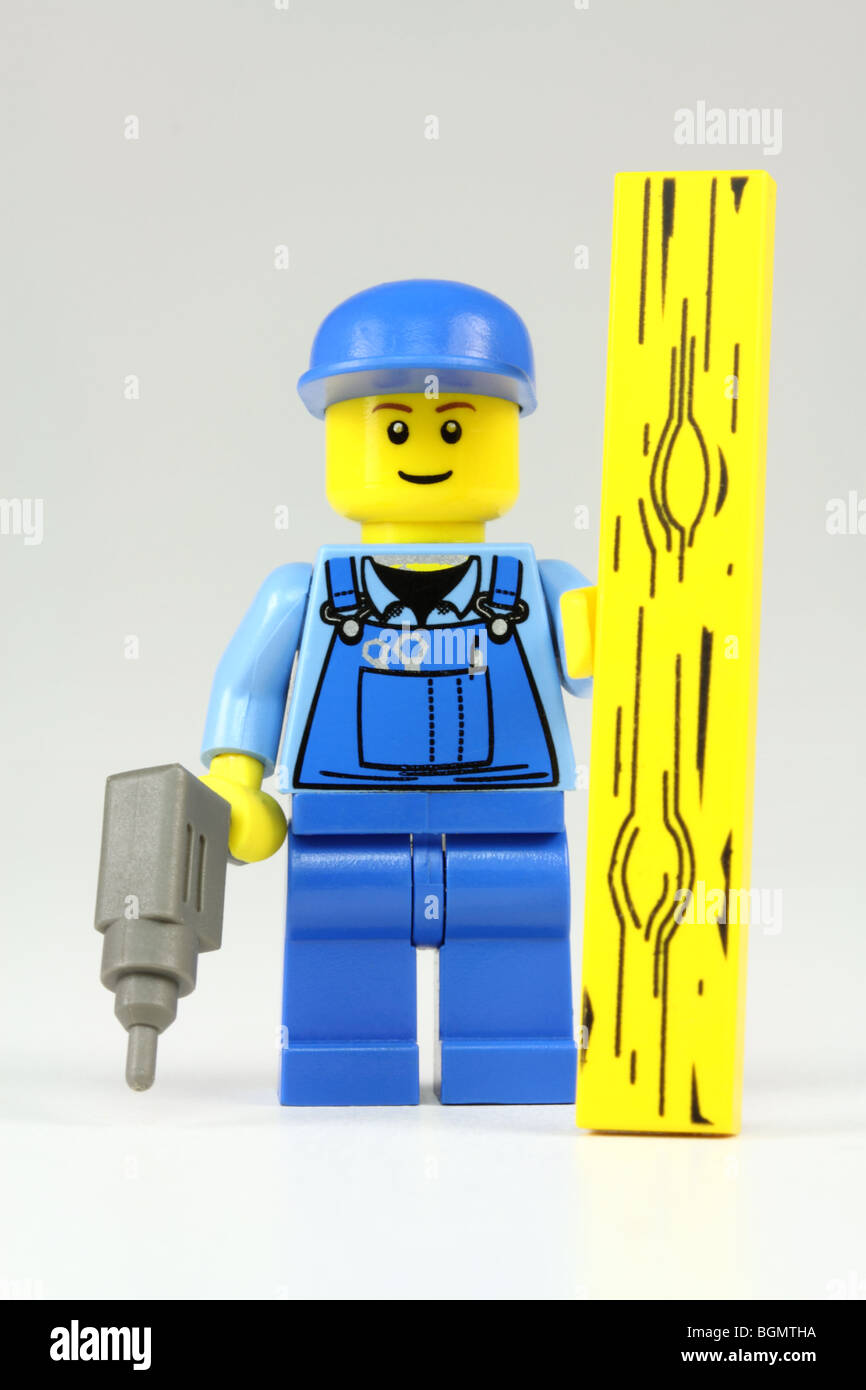 Lego DIY enthusiast or handyman with drill and plank Stock Photo