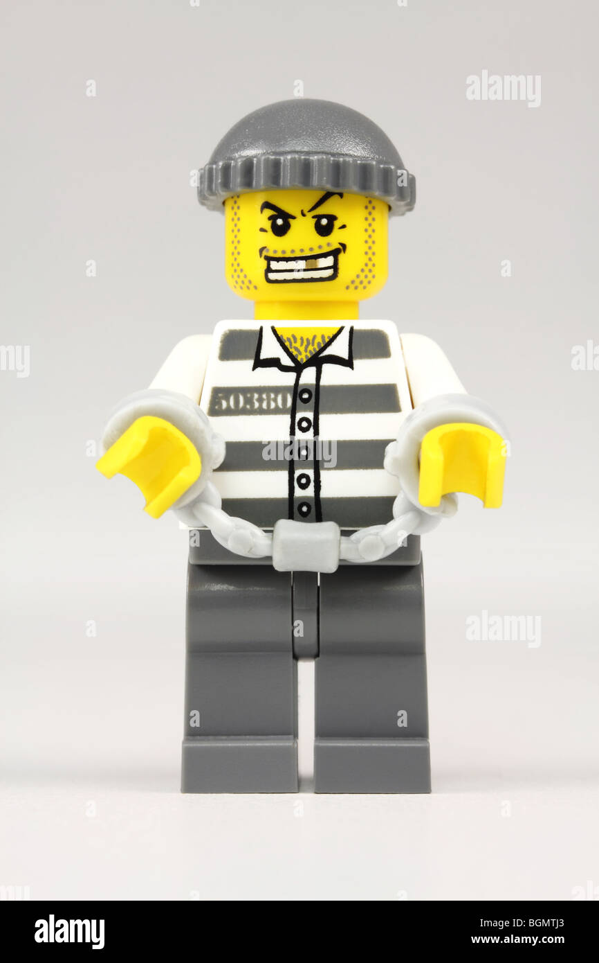 Lego prisoner in hand-cuffs Stock Photo