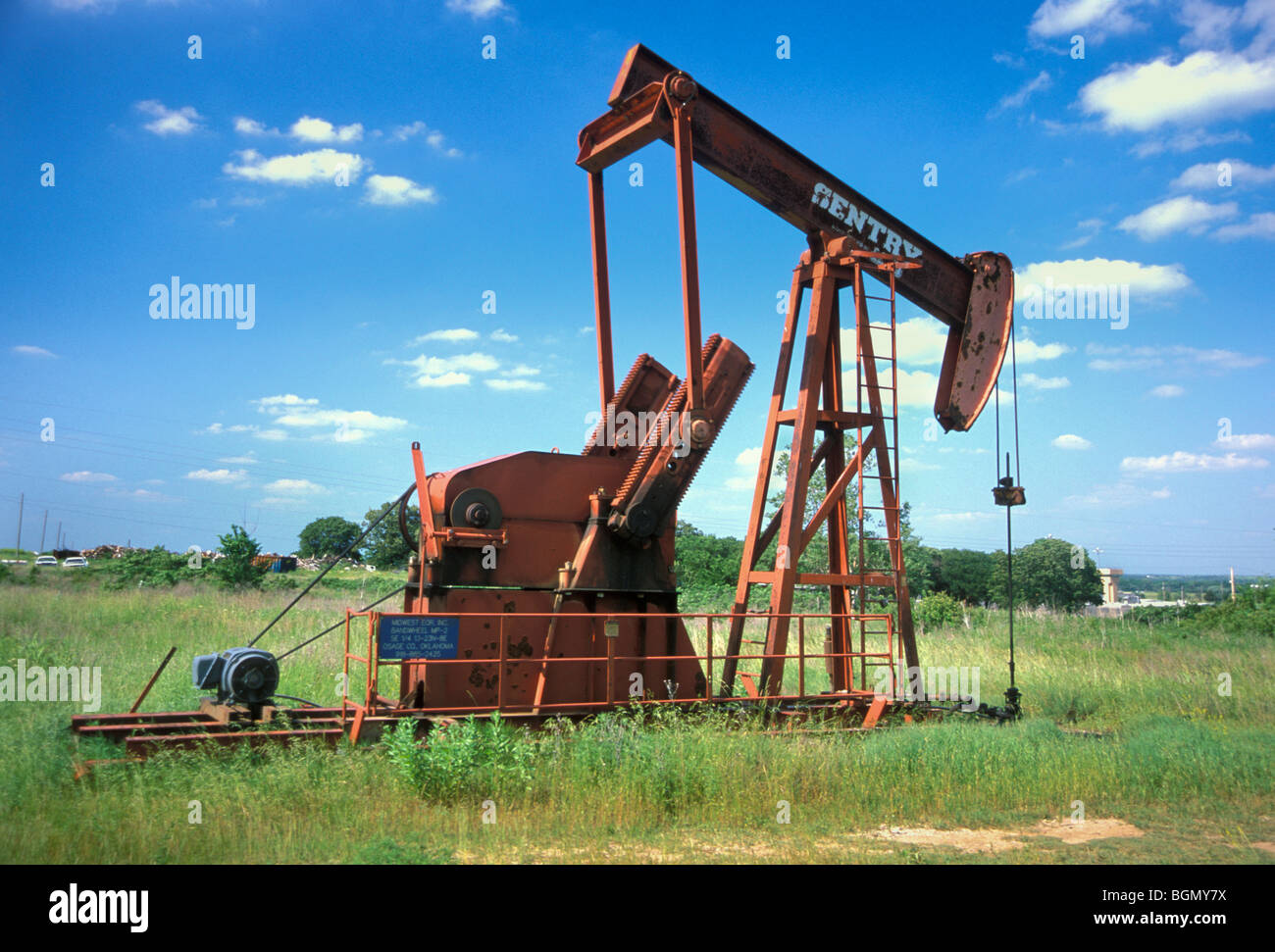 Many oil rigs are set up throughout Oklahoma on Tribally owned land such as here on Cherokee ground. Stock Photo