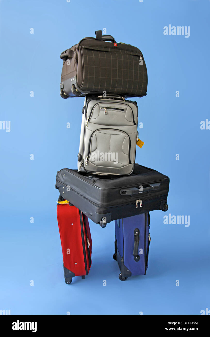 too many suitcases stacked up waiting Stock Photo Alamy
