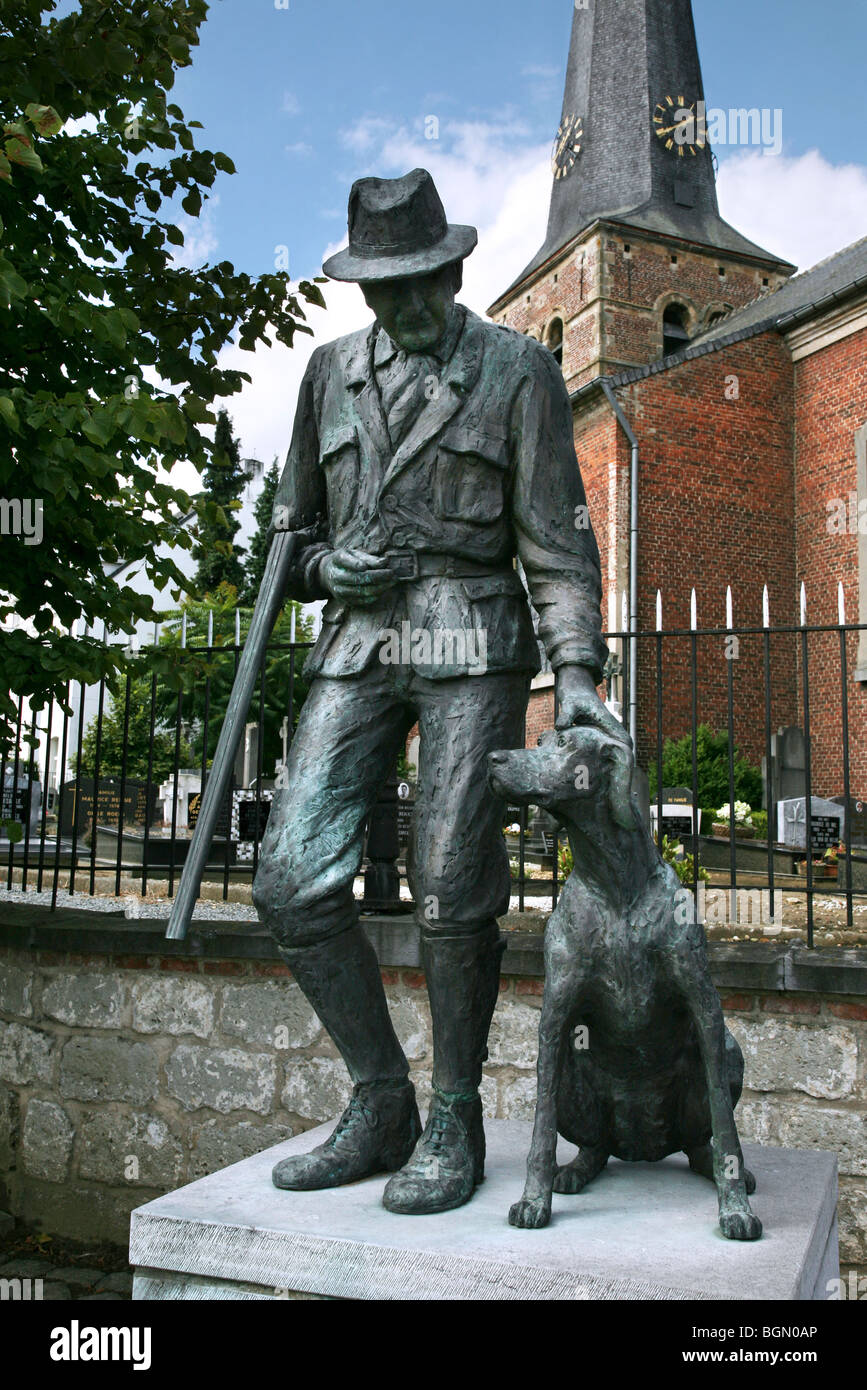 Statue of hunter with hunting hound, Zwalm-Beerlegem, Belgium Stock Photo