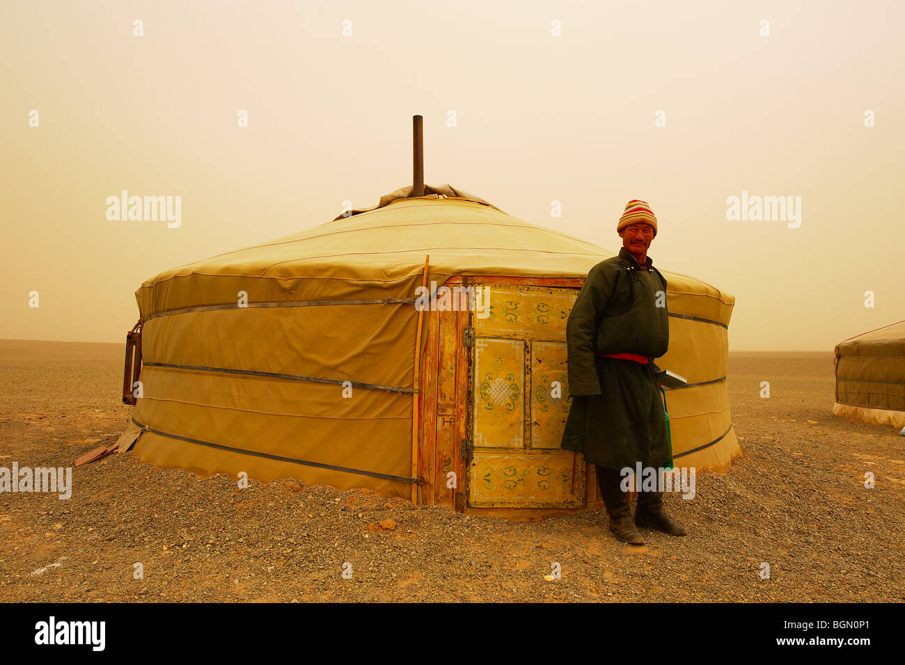 Mongolian man in front of his ger Stock Photo