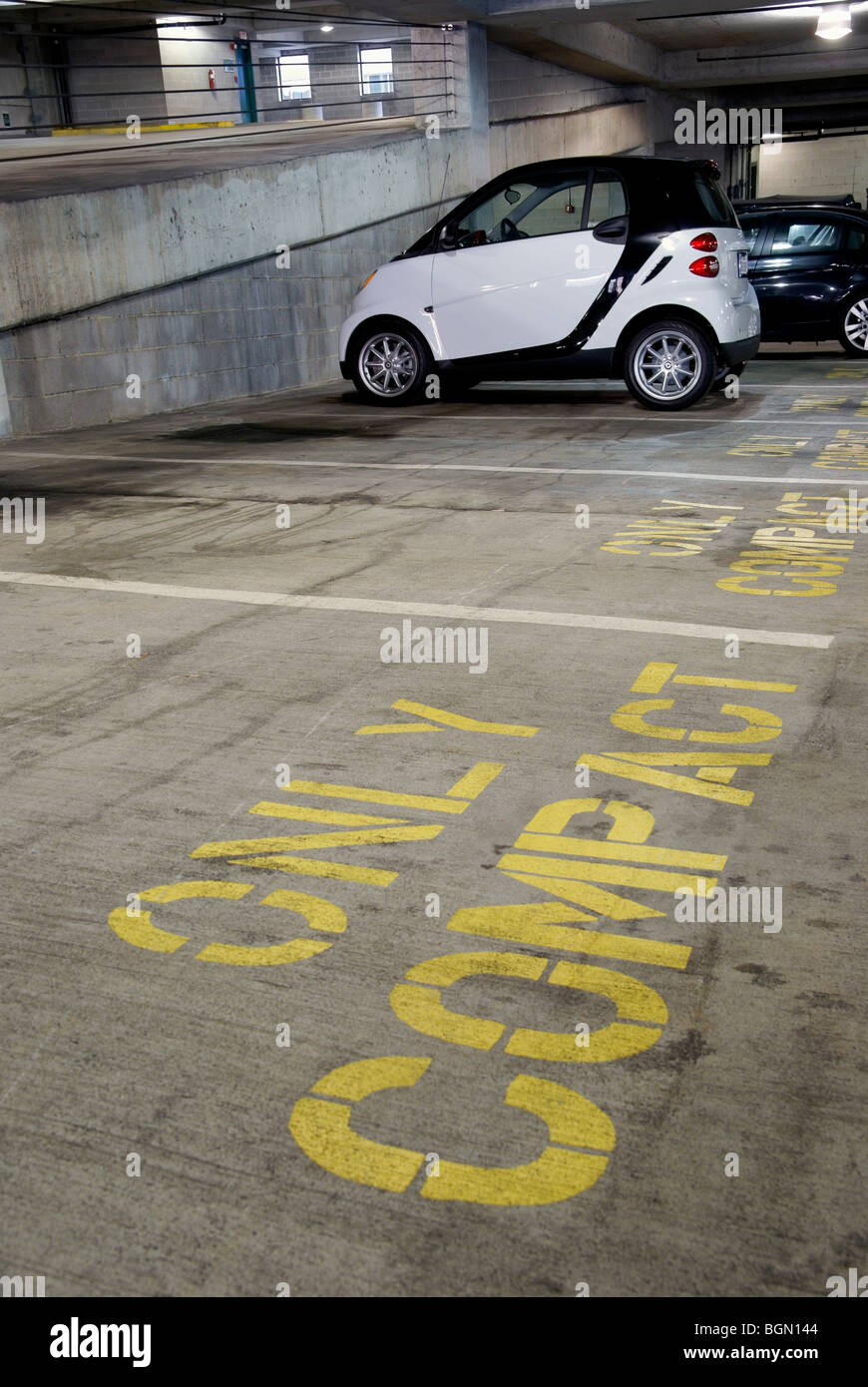 Compact car in parking garage Stock Photo