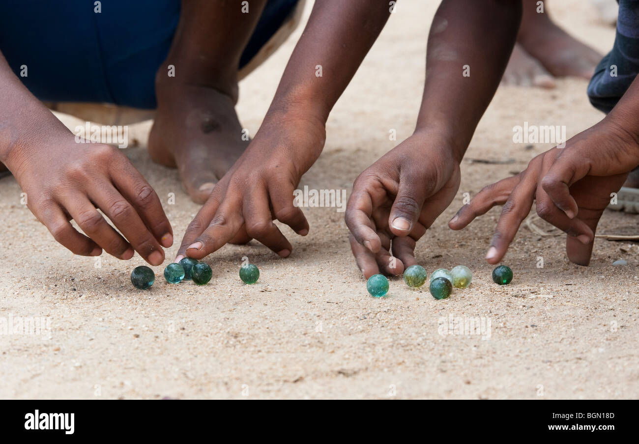 Indian boys playing marbles on the street. India Stock Photo Alamy