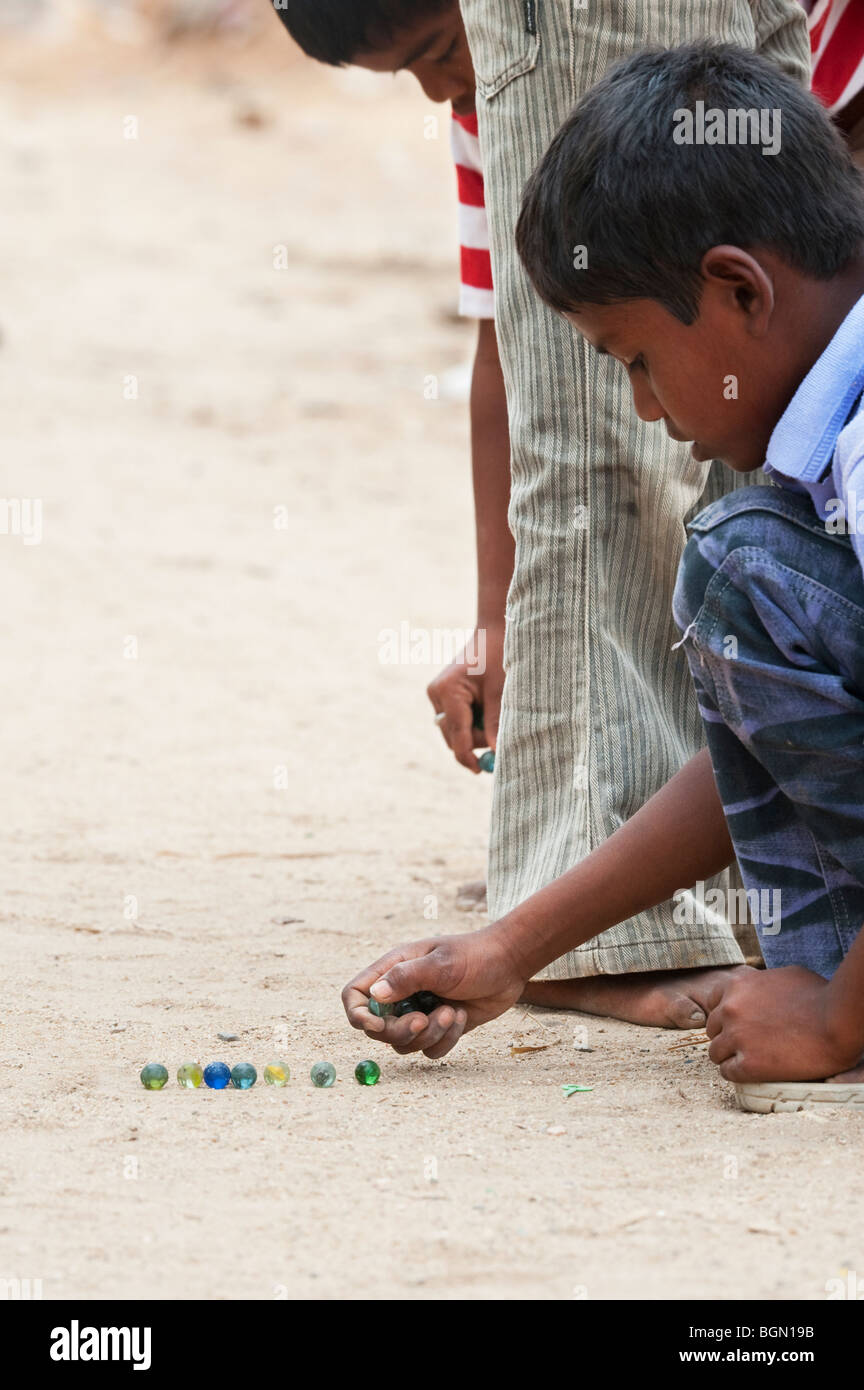Indian boys playing marbles on the street. India Stock Photo Alamy