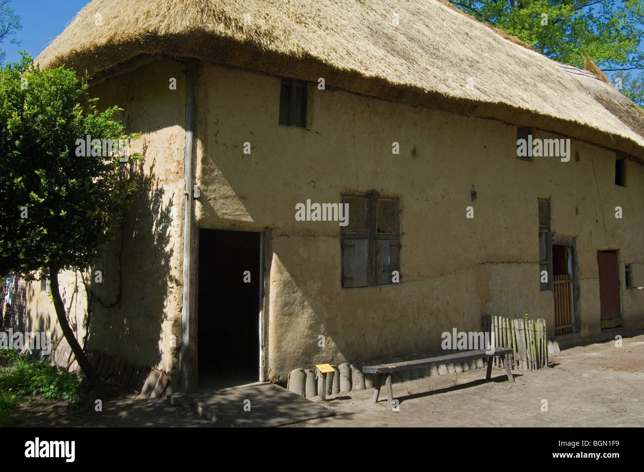 Traditional loam farmhouse with thatched roof in the open air museum Bokrijk, Belgium Stock Photo