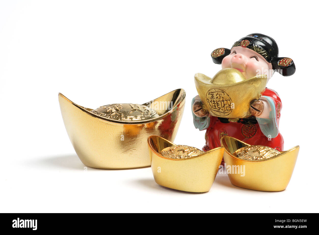 God of Wealth Figurine with Gold Ingots Stock Photo