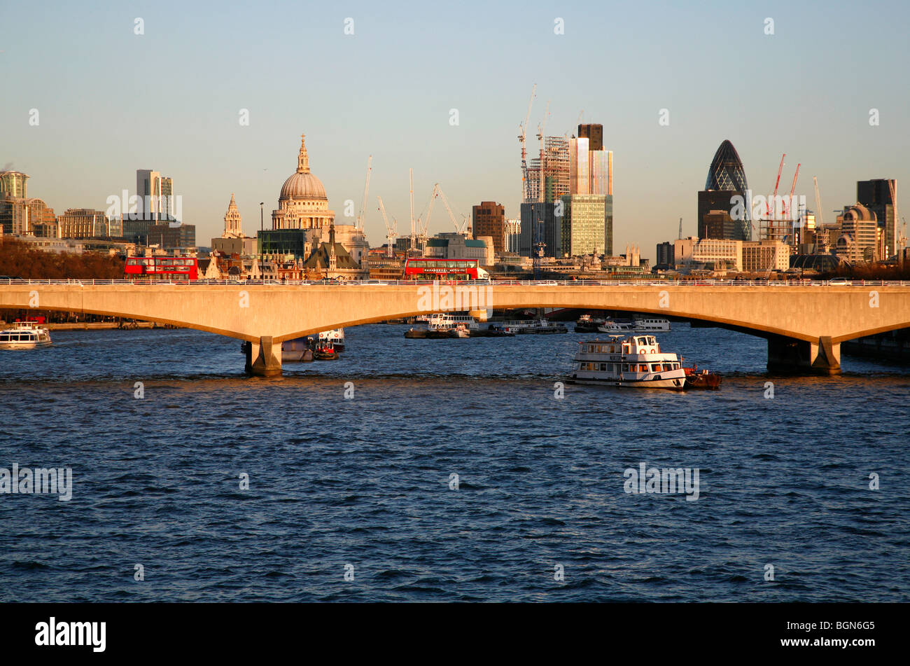 Looking down the River Thames to Waterloo Bridge and beyond to St Paul's Cathedral and City of London, UK Stock Photo