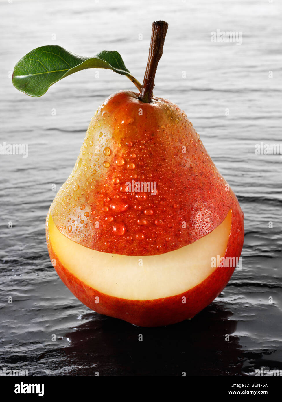 Wole Red Williams pear with a smiley face Stock Photo