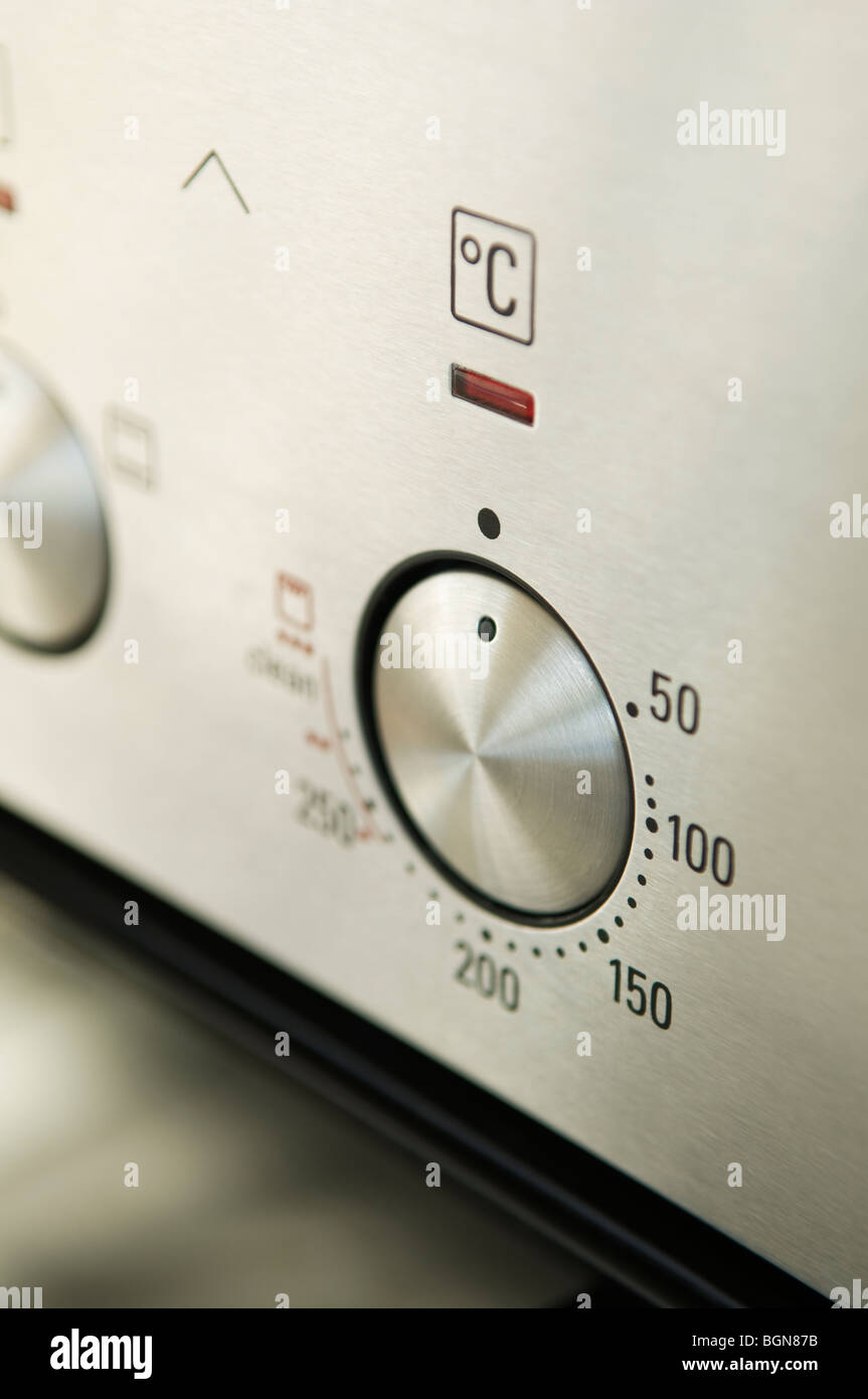 Stainless steel oven dial thermostat Stock Photo